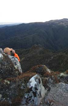 Hunter with binoculars. Photo: David Conley.