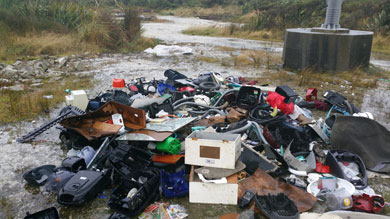 Dumped rubbish on conservation land along Tiwai Road. 
