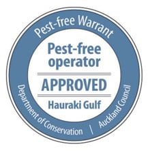 Pest Free Warrant logo – a round logo with a blue bar around the outside. Pest-free Warrant is shown prominently on the logo. Pest-free operator, approved, and Hauraki Gulf also shown. At the bottom it lists both Department of Conservation and Auckland Council