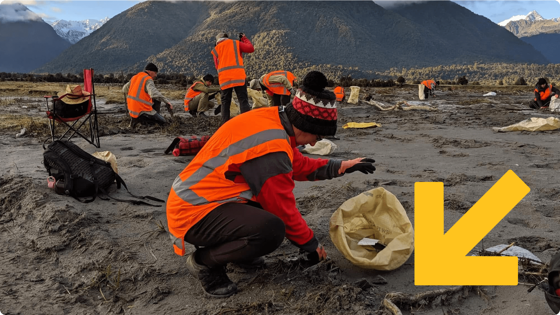 Volunteers in high-vis vests clean up the river bed at Fox River.
