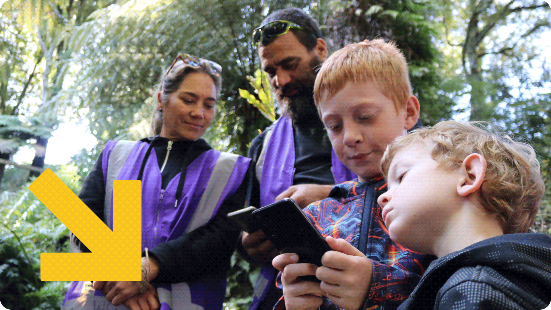Tū Mātau Ora adults with children in the forest.