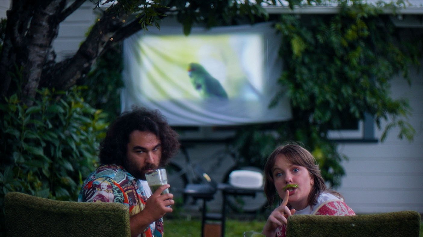 Upside down photo of woman standing near plants.