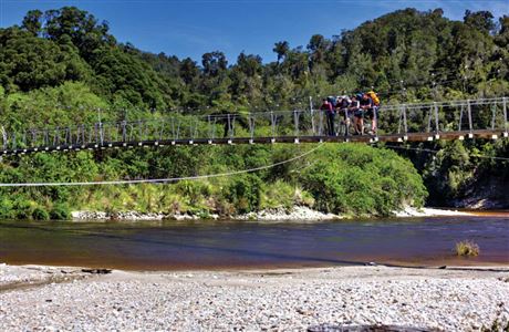 Walks on swing bridge. 