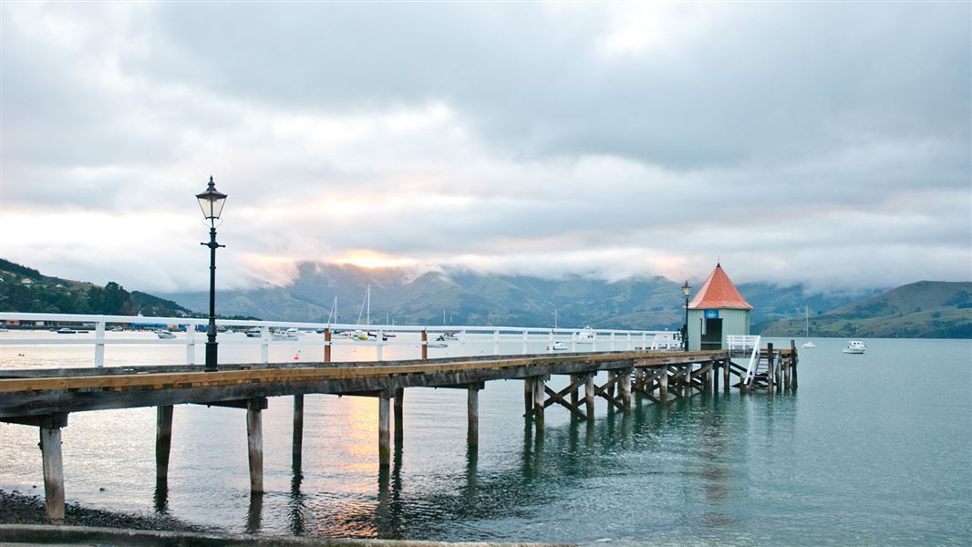 Daly's wharf and boats on Akaroa Harbour.