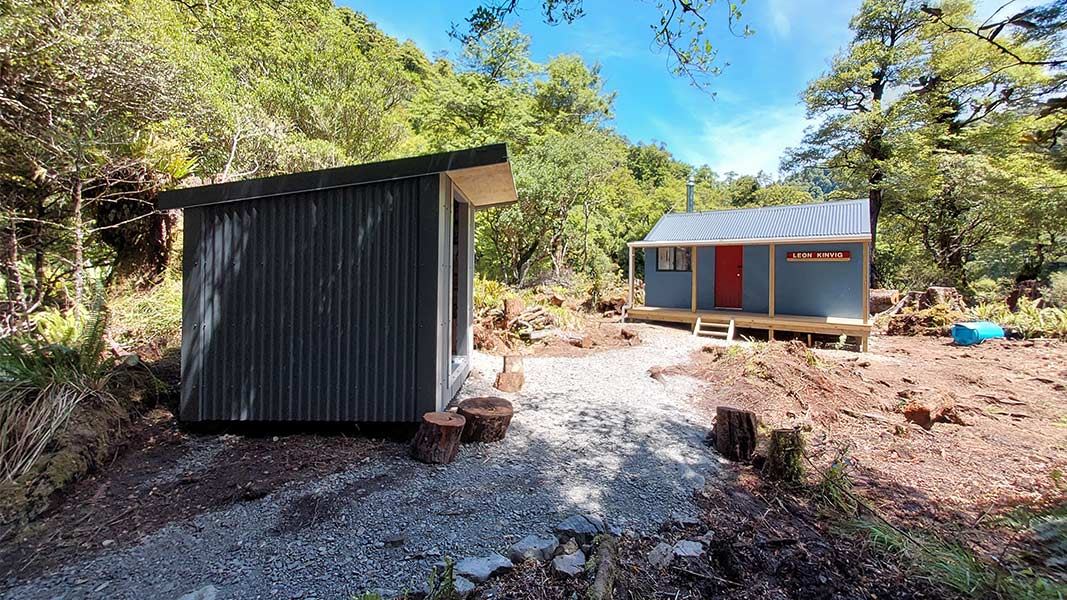 Exterior of the refurbished Leon Kinvig Hut and new woodshed. 