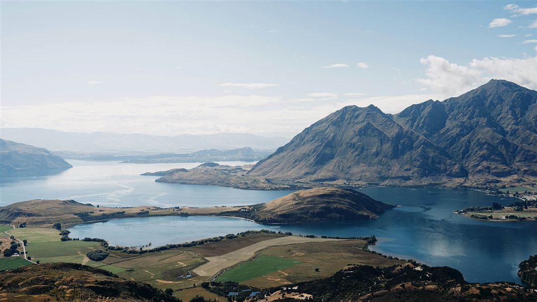 View of a lake surrounded by hills.